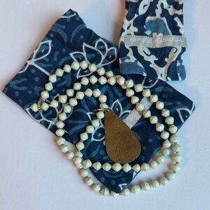 Noonday paper bead necklace with removable brass dangle charm